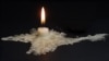 Ukraine – Blackout. Crimea without power supply from Ukraine. A candle melted In the shape of Crimea symbolizes the disconnection of the peninsula from electricity.